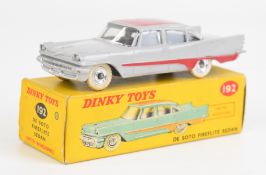 Dinky Toys diecast model De Soto Fireflite Sedan with grey body, red trim and roof, cream tyres