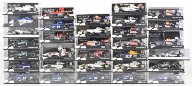 Thirty two Paul's Model Art Minichamps 1:43 scale diecast model Formula 1 racing cars, all in
