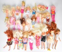 Twenty five Barbie and similar younger sibling and child dolls, most in original outfits.