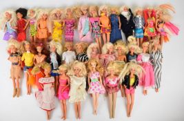 Thirty two Mattel Barbie dolls, all in original outfits.