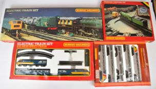 Three Hornby 00 gauge model railway sets comprising R.695, R.794 and R.825, together with an