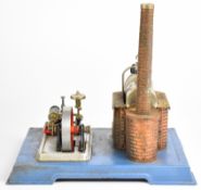 Two Wilesco live steam stationary engines comprising D10 and D455, the latter mounted on a wooden