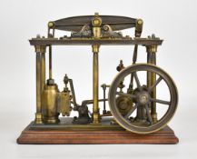 Likely Polish built live steam beam engine with spoked flywheel and gear driven working governor, on