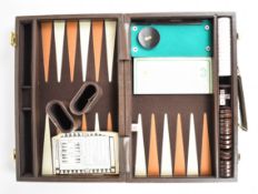 Designer Backgammon set with thirty counters, dice, shakers and rulebook, in fitted leather case