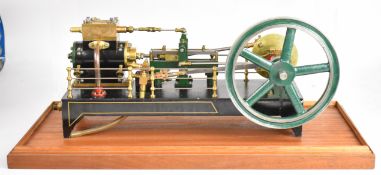 Single cylinder live steam engine modelled on an 1890's mill engine with spoked flywheel, disc crank