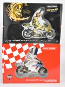 Two Paul's Model Art Minichamps 1:12 scale diecast model MotoGP motorbikes and riders comprising