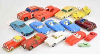 Fourteen vintage tinplate and plastic bodied Jaguar toy cars.