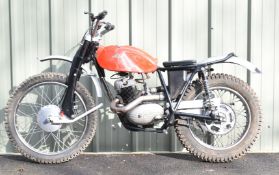Circa 1962 Cotton 250cc two stoke trials motorcycle with red fibreglass fuel tank and aluminium