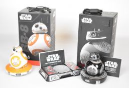 Two Sphero Star Wars app enabled remote control droids comprising BB-8 and BB-9E, both in original