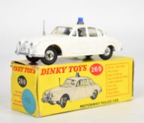 Dinky Toys diecast model Motorway Police Car with white body, cream interior, driver, passenger,