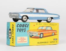 Corgi Toys diecast model Oldsmobile Super 88 with pale blue body, white racing stripe and red
