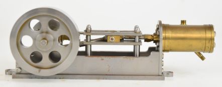 Horizontal single cylinder live steam engine in the style of a small Stuart S50 with drilled disc