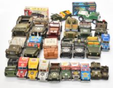 Twenty six tinplate Willys Jeep cars, to include Tri-ang, Arnold and Tonka.