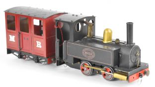 Mamod live steam 32mm or 0 gauge locomotive, together with a Mamod passenger carriage, length of