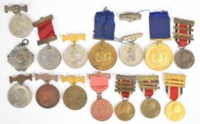 Fifteen good attendance medals from Queen Victoria 1896 through Edward VII and George V, including
