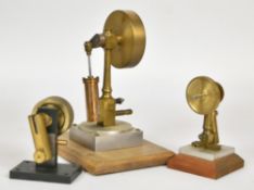 Three oscillating live steam engines, two of similar design with turned brass central columns,