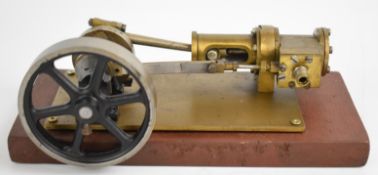 Horizontal single cylinder live steam engine with spoked flywheel, on wooden base, overall length