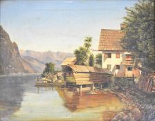 19th or early 20th century continental school oil on canvas house beside a lake with boathouse,