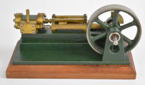 Horizontal single cylinder live steam engine in the style of a small Stuart S50 with spoked