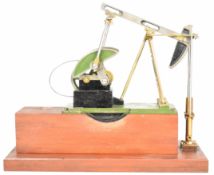 Stuart oil field pump or nodding donkey, on wooden base with space for electric motor or live
