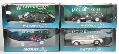 Four Auto Art Classics Division 1:18 scale diecast model cars comprising two Jaguar XK-SS, Jaguar