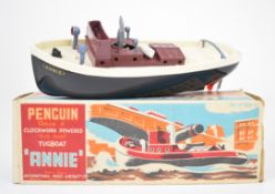 Penguin clockwork powered Tugboat 'Annie', in original box with key.