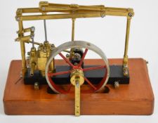 Small live steam beam engine with spoked flywheel, on wooden base, overall length 21cm