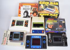 Four retro LCD digital tabletop games by Grandstand, Entex and Palitoy comprising Cave Man, Kevin