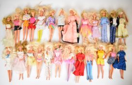Twenty five Mattel Barbie dolls, all in original outfits.
