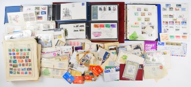 A collection of GB and world stamps in various albums, some GB first day covers, a small quantity of