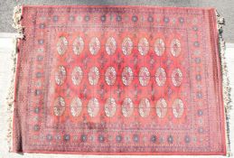 Turkoman rug with twenty four guls on a wine ground, 195 x 140cm