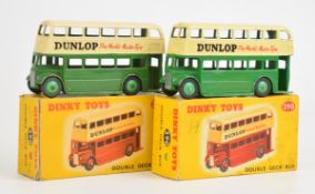 Two Dinky Toys diecast model Double Deck Buses, both with green body, cream roof and Dunlop