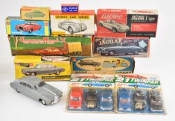 Eleven vintage Jaguar friction and battery operated toy cars to include Telsalda examples, all in