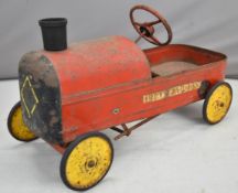 Tri-ang 'Duke Express' pressed steel pedal car in the style of a locomotive, length 74cm.