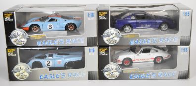 Four Eagle's Race diecast model sports cars comprising Porsche 911 Carrera, 917K Gulf, Ford GT-40