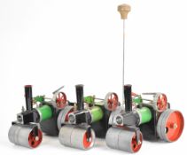 Three Mamod SR1 and SR1a live steam rollers including one with steering extension rod and one with