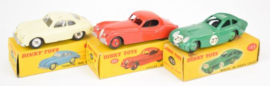Three Dinky Toys diecast model sports cars comprising Jaguar XK120 Coupe 157, Bristol 450 Sports 163