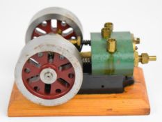 Single cylinder poppet valve live steam engine with twin cam valve drive and twin 7cm flywheels,