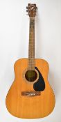 Yamaha F310 acoustic guitar in natural finish with spruce top, rosewood back and fingerboard, made