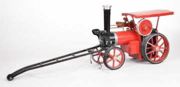 Mamod live steam crane engine with red wheels, boiler and canopy
