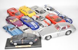 Twelve 1:18 and 1:12 scale diecast model sports cars by Bburago and Maisto to include Porsche 911