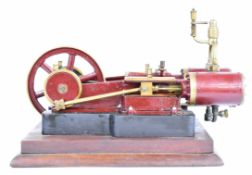 Victorian or early 20th century style twin cylinder live steam engine with spoked flywheel, and