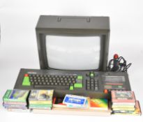 Amstrad CPC464 64K colour personal computer with monitor, joystick and a collection of and games.