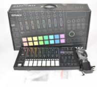 Roland MC-707 Groovebox music sequencer with drum machine and synth capabilities, in original box