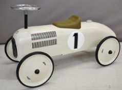 Vilac ride on pressed steel vintage style racing car with cream body, black trim, olive green seat