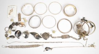 Collection of silver jewellery including twelve bangles, ingot, chains, Siam brooches, Siam