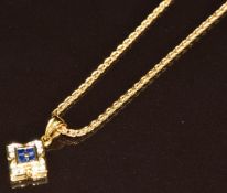 An 18k gold pendant set with sapphires and diamonds, on 18k gold chain