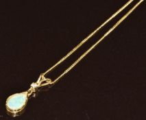 A 9k gold pendant set with a pear cut opal and diamond on 9k gold chain, 1.2g