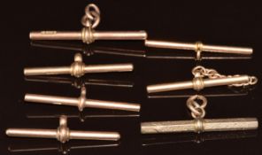Six 9ct gold T bars (20.3g) and one Victorian yellow metal T bar (4.7g)