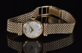 Jaeger LeCoultre 9ct gold ladies wristwatch with gold hands and hour markers, silver dial and signed